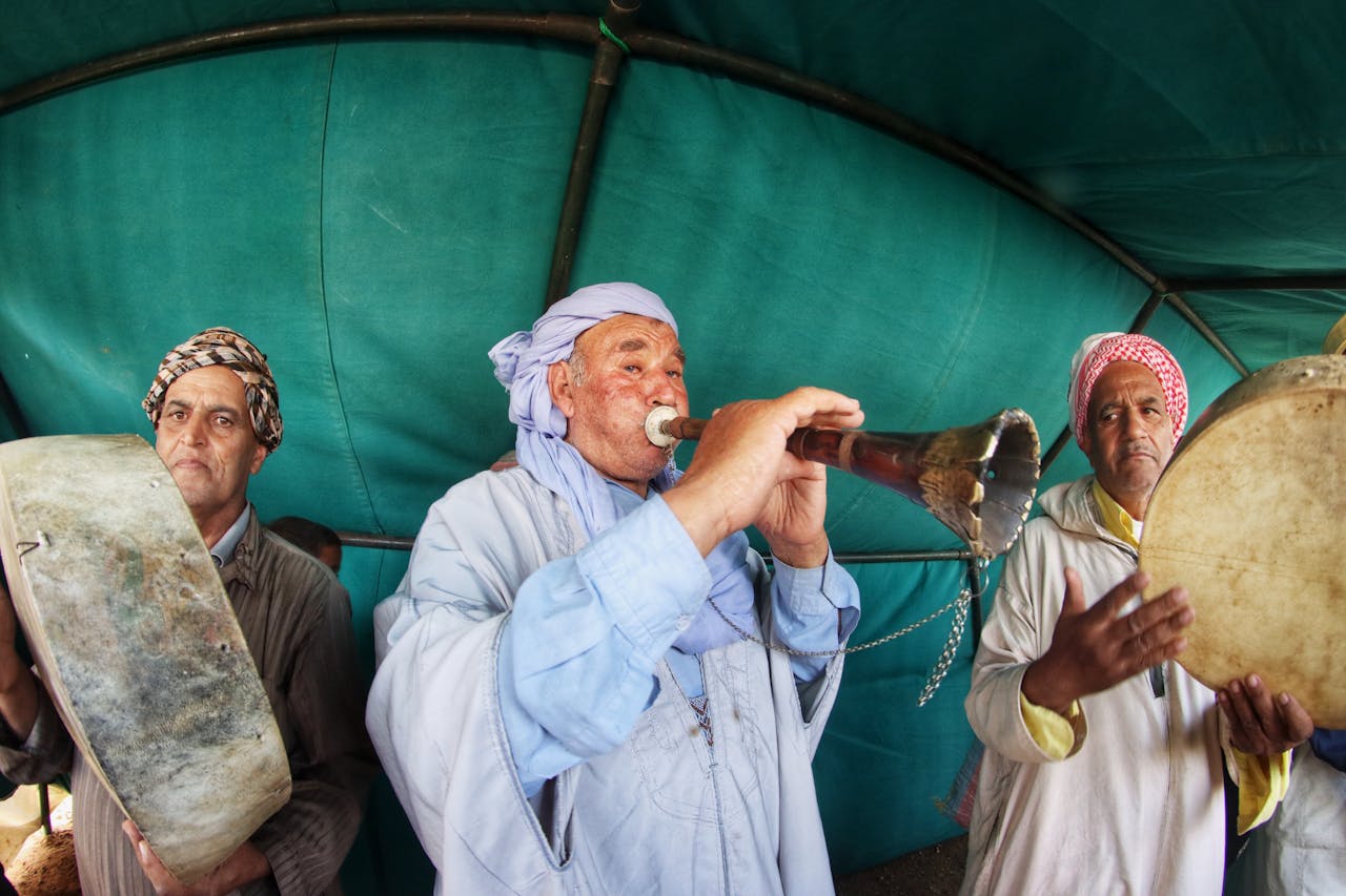 Musicians performing traditional Algerian music in a tent in Algiers.